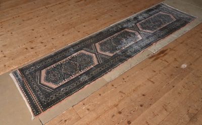an image of a long rug on a wooden floor