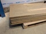 several pieces of plywood are stacked on top of each other