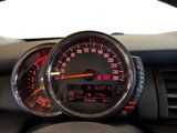 a close up of a car dashboard with a speedometer
