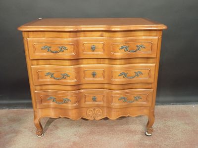 an image of a wooden chest of drawers with drawers on top of it