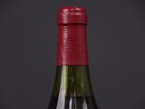 a bottle of wine that is sitting on a table