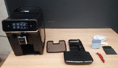 an image of a coffee machine and other items on a table