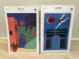 two framed paintings of a woman diving in a pool