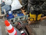 a pile of assorted items on a pallet in a warehouse