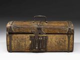 an old wooden box with a latch on top of it
