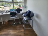 two chairs that are sitting in front of a window