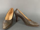 a pair of women ' s shoes on a grey background