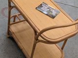 a small table with a magazine on it on the sidewalk
