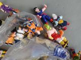 toy figurines in a plastic bag on a table