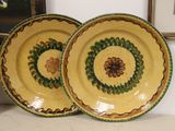 two plates that are sitting on a table