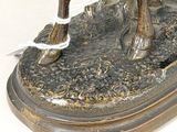 bronze statue of a man on a horse with a rope around his neck