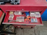 a red tool box with many different tools in it