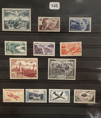 an assortment of stamps from different countries on display in a display case