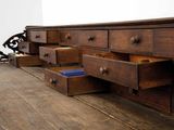 many drawers that are sitting on a wooden table