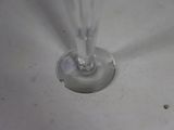 a close up of a glass of wine in a sink