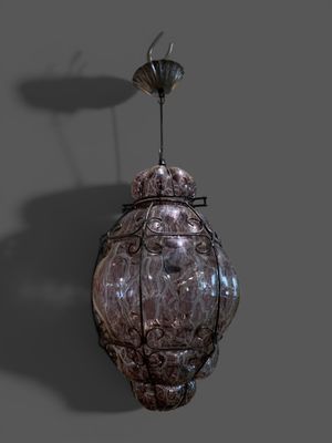 une image représentant une lampe suspendue au plafond, surmontée d'un oiseau