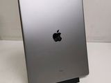 an apple ipad is sitting on a table with a white background