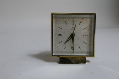 a small clock that is sitting on a table