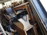 several pieces of furniture are stacked on a shelf in a room