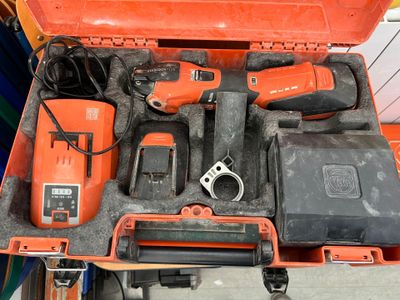 an orange tool case with tools inside of it