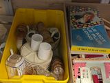 two bins filled with different types of items on the floor