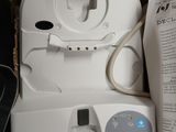 a box with a toilet and a toilet paper dispenser in it