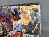 a lot of comic books on display on a table