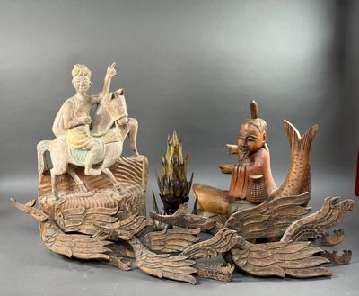 une statue représentant un homme et une femme assis sur une bûche