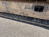 a close up of a bulldozer on the ground