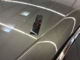 a remote control on the hood of a car