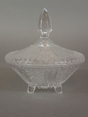 a clear glass bowl with a lid on a table