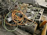 a pile of wires and other electrical equipment on a pallet