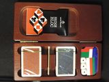 a wooden box with a game set inside of it