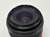 a close up of a camera lens on a white surface