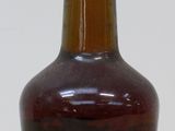 a bottle of liquor sitting on a wooden table