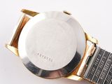 an image of a close up of a watch on a white surface