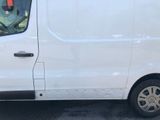 a white van that is parked in a parking lot