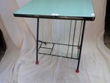 a table with a glass top on a white cloth