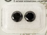 two black diamond stones in a package on a white background