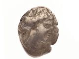 an image of a silver coin with a woman ' s face on it