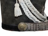 a black hat with a rope and a button on it