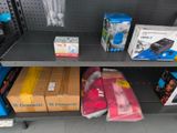 a shelf with many different types of electronics on it