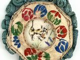 a picture of a decorative object with a cat on it