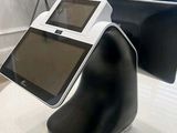 a tablet computer sitting on a stand in a room