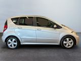 a picture of a silver car parked in a garage