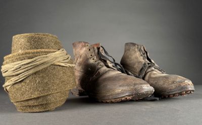a pair of shoes that are tied up with a rope