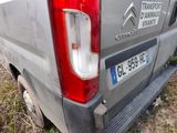 a silver van that is parked on the side of the road