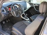 the interior of a car with a steering wheel and a dashboard