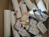 many rolls of white paper in a box