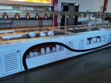 a long buffet with many different types of food on it